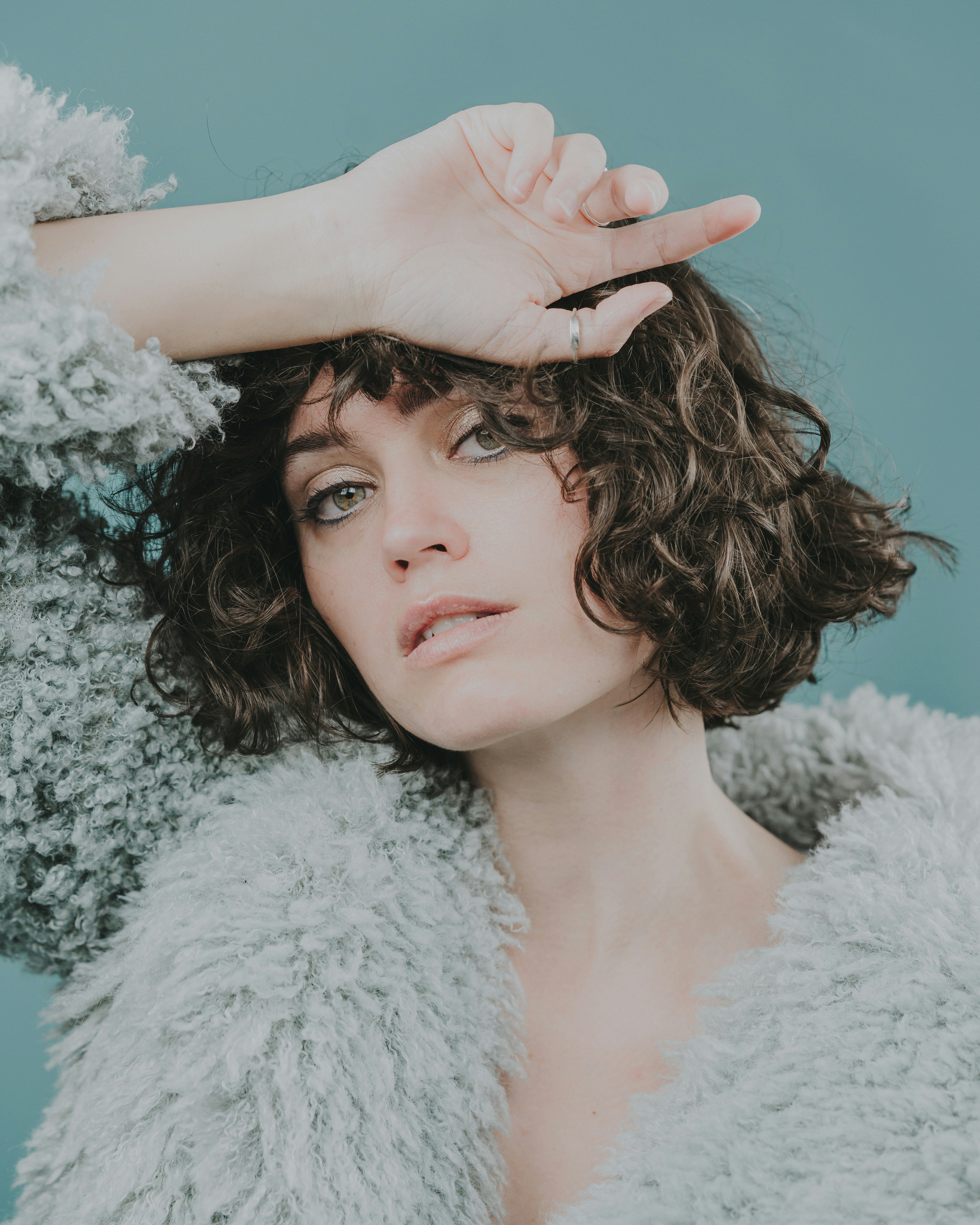 woman in white fur coat